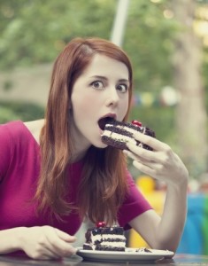 young lady eating cake